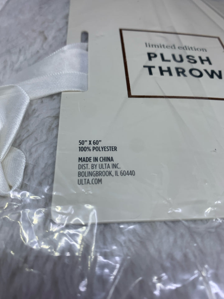 NIP PLUSH THROW.