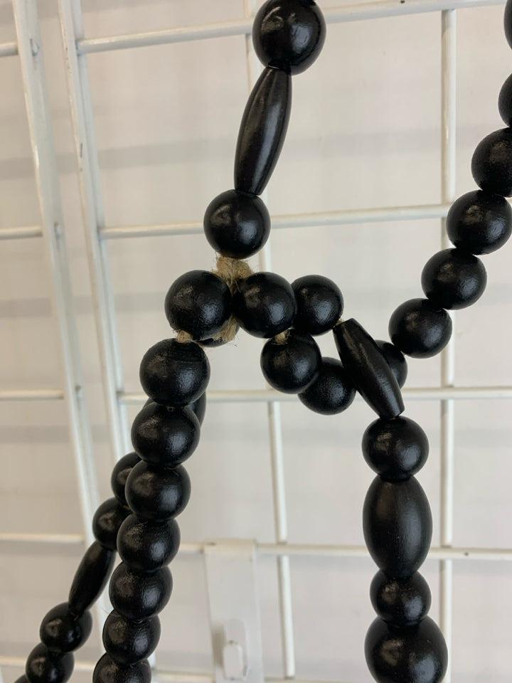 BLACK WOODEN BEADED GARLAND.