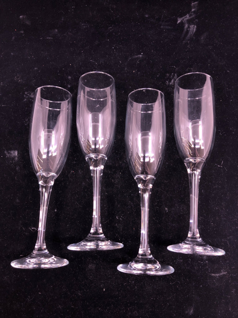 4 CLEAR CHAMPAGNE GLASSES.