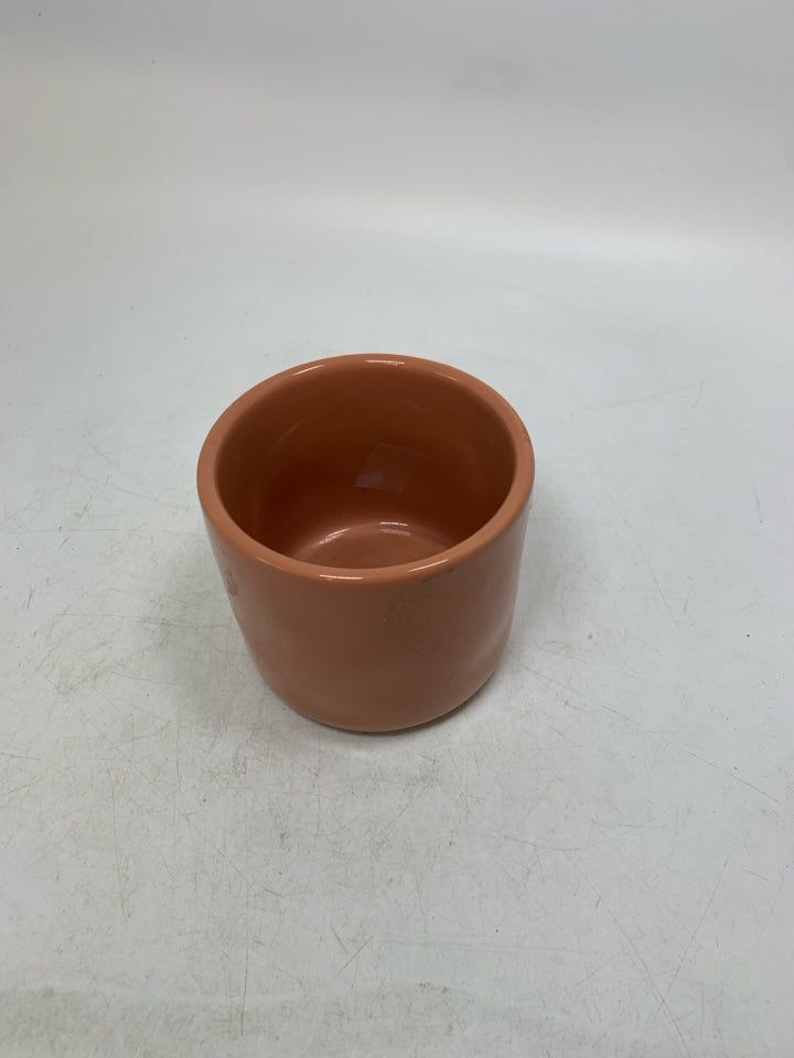 RAE DUNN PALE ORANGE SPICED PLANTER.