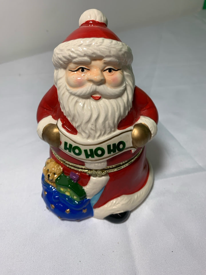 CERAMIC SANTA MUSIC BOX W/ REINDEER PULLING SLAY INSIDE.