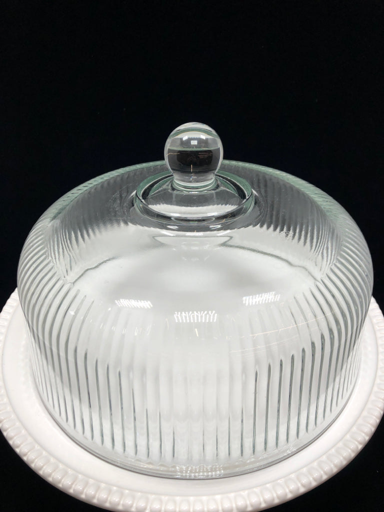 RAISED WHITE CAKE STAND W/GLASS COVER.