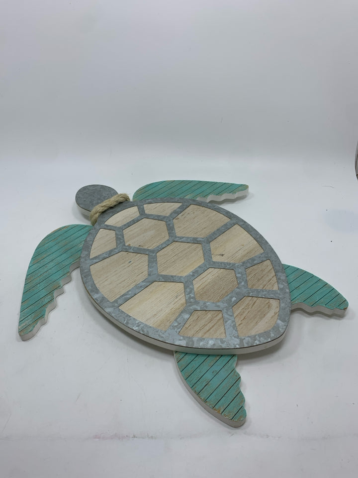 WOODEN SEA-TURTLE WITH BLUE FINS.