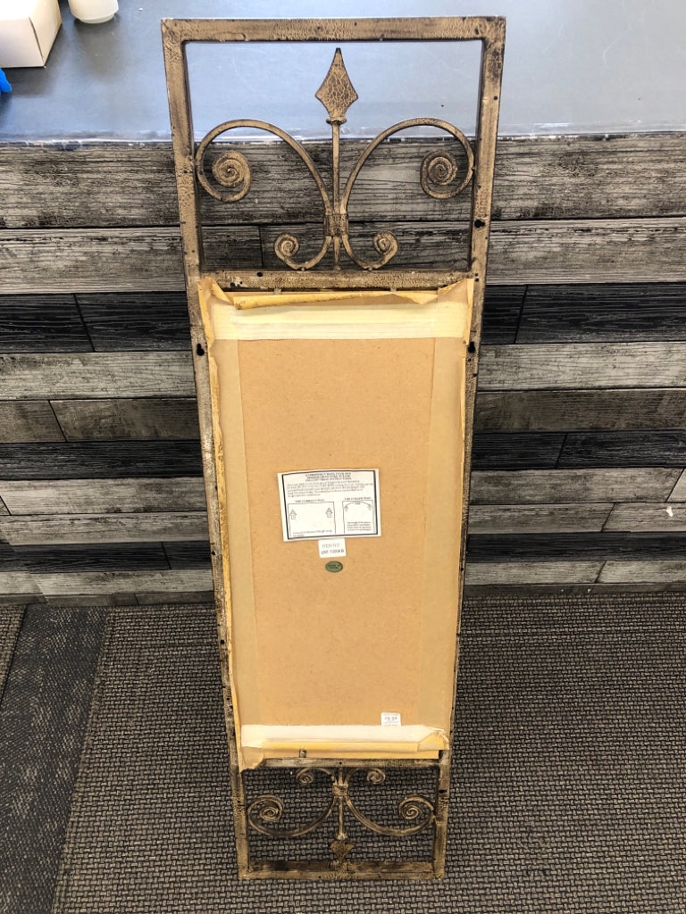 BRONZE MIRROR W/SCROLL DESIGN FRAME.