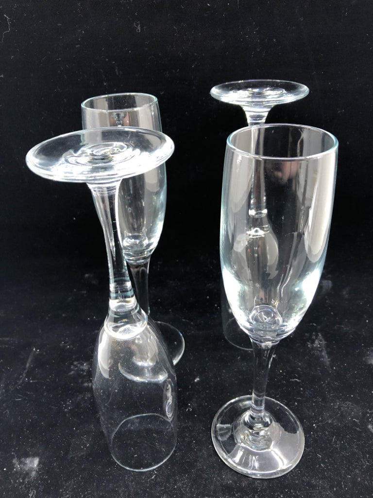 4 CLEAR CHAMPAGNE GLASSES.