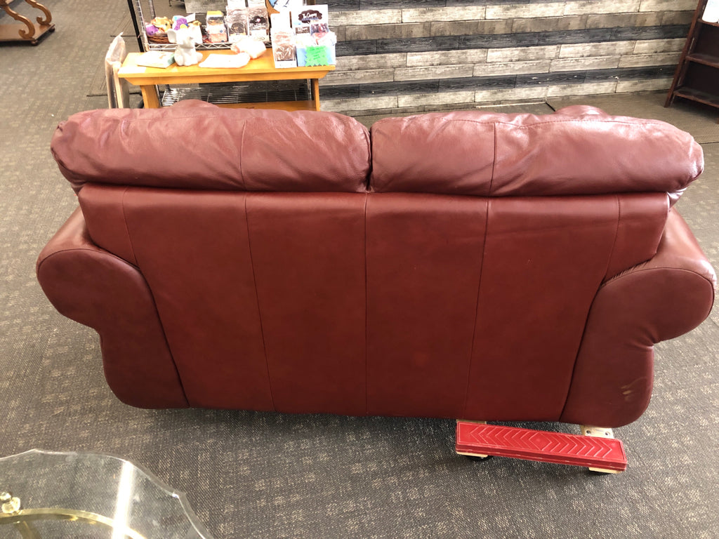 DARK BROWN STUDDED LOVE SEAT.