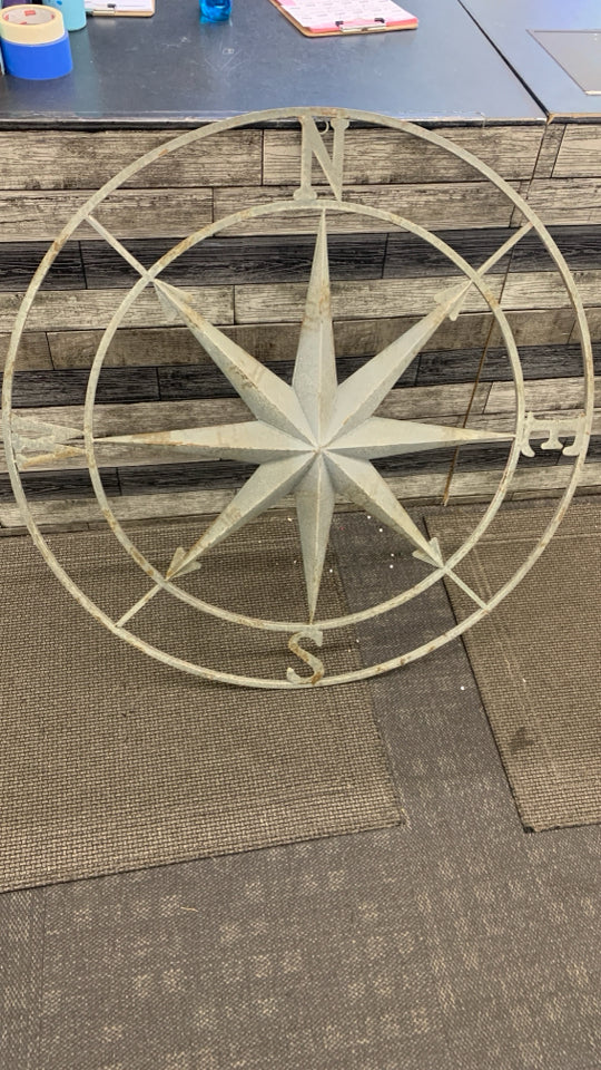 LG METAL DISTRESSED CARDINAL DIRECTIONS WALL HANGING.