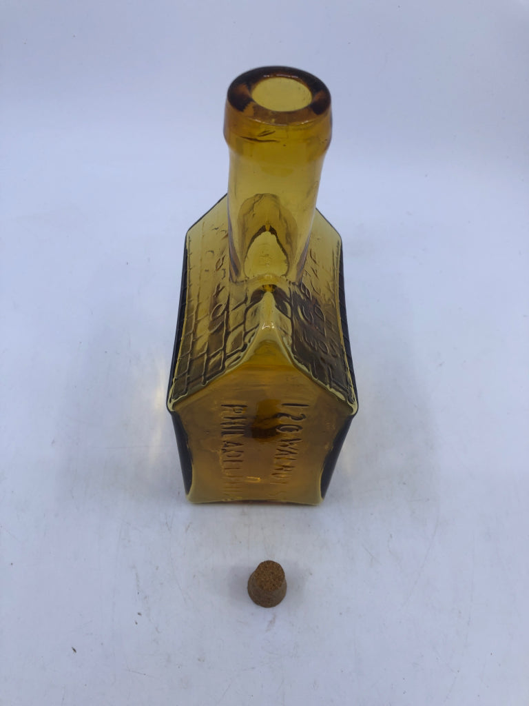 VTG OLD CABIN WHISKEY HOUSE SHAPED AMBER GLASS EMPTY DECANTER.