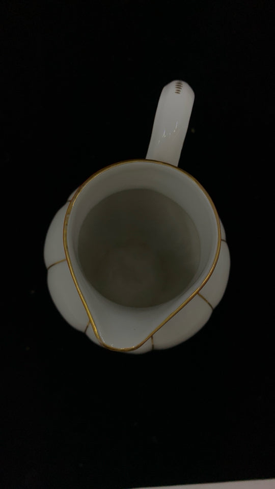 VTG GOLD RIBBED ORANGE SPOUT PORCELAIN PITCHER.
