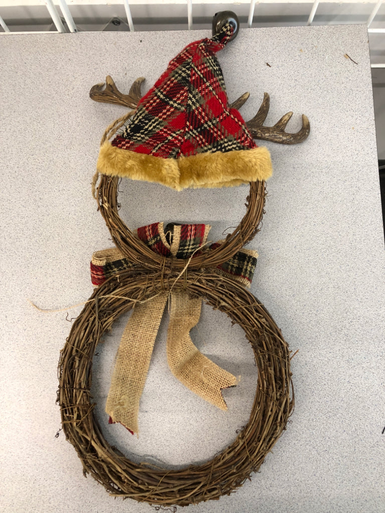 TWIG SNOWMAN W/ANTLERS HANGING.