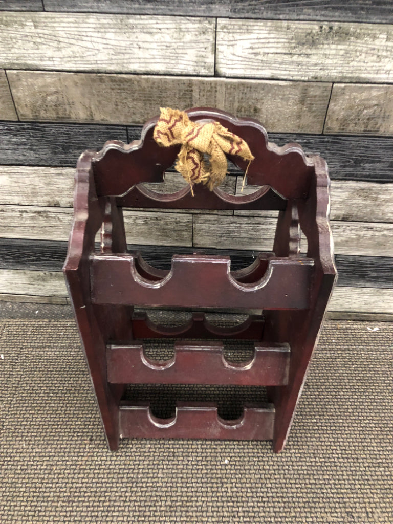 PRIMITIVE WINE HOLDER.