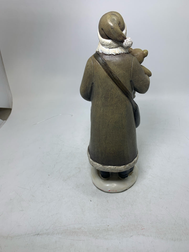 RESIN SANTA IN BROWN SUIT HOLDING TEDDY BEAR.