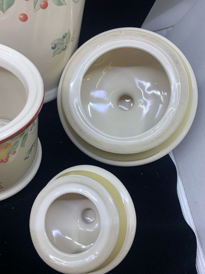 4 PC CANISTER SET CREAM W/ ASSORTED FRUITS/ RED RIM.