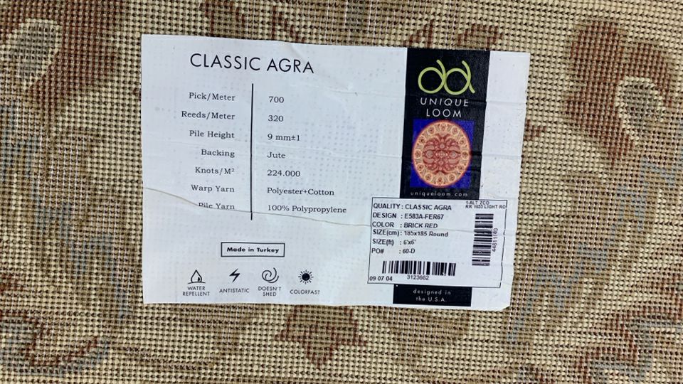 GOLDEN CIRCLE RUG W/LEAF DESIGNS.