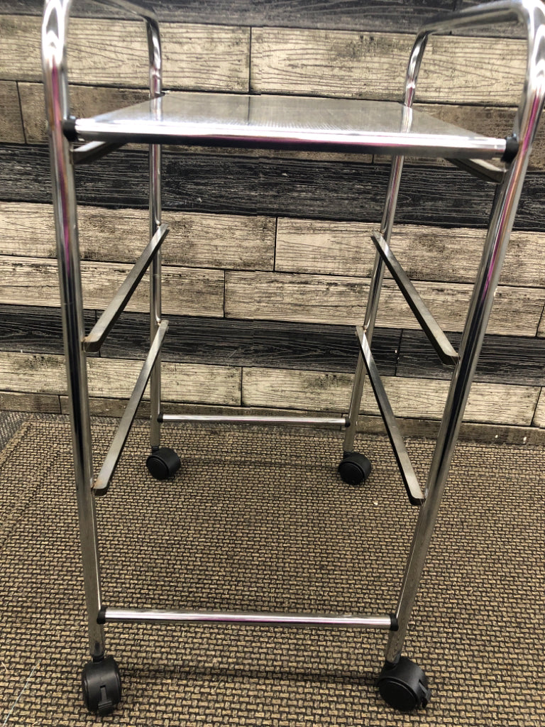 3 TIER BLACK PLASTIC/SILVER METAL STORAGE ROLLING CART.