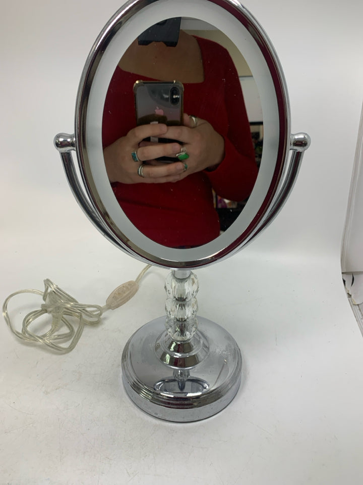 OVAL LIGHT UP VANITY MIRROR.