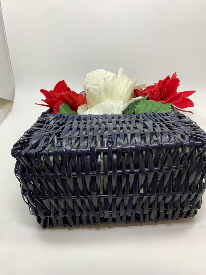 RED WHITE AND BLUE BOUQUET IN BLUE BASKET.