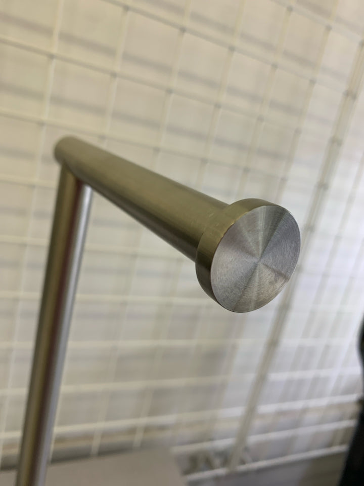 SILVER METAL STANDING TOILET PAPER HOLDER.
