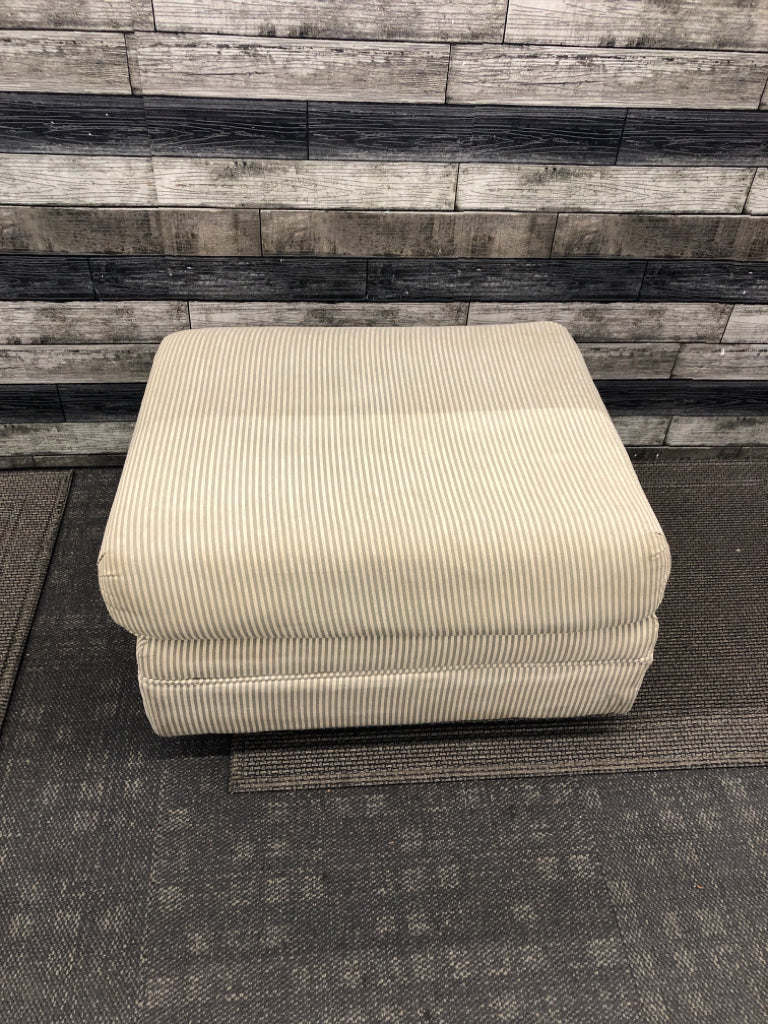 TAN/GREY STRIPED OTTOMAN.