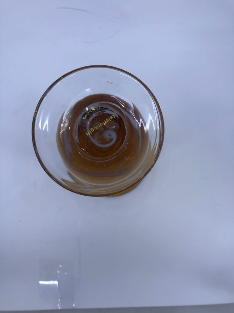 AMBER GLASS FOOTED VASE W/WHITE SWIRL.
