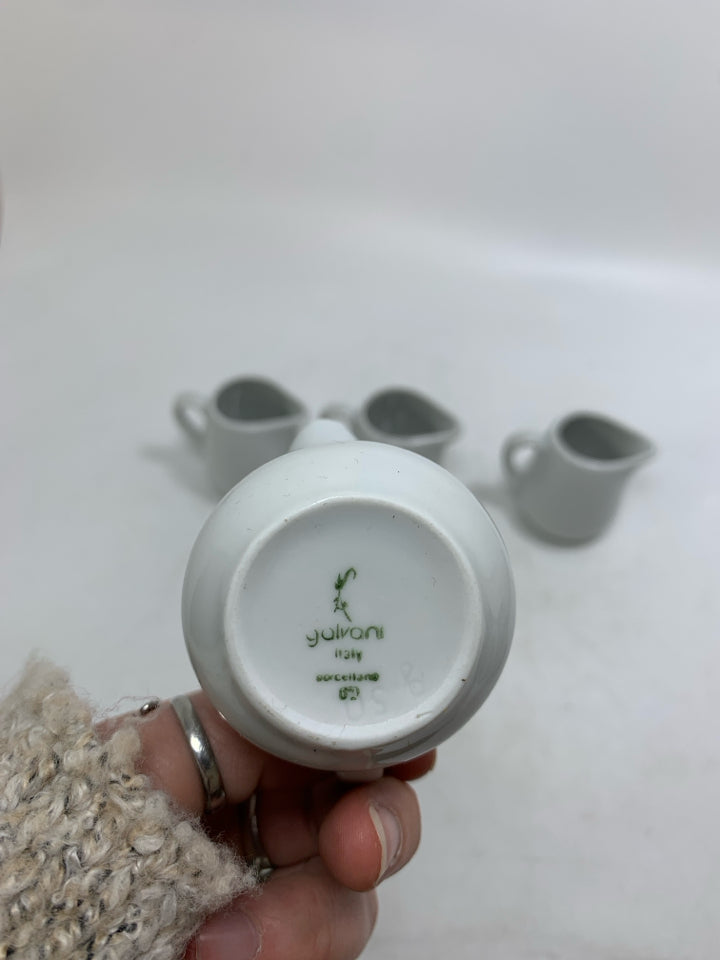 4 MINI WHITE PORCELAIN PERSONAL CREAMERS.