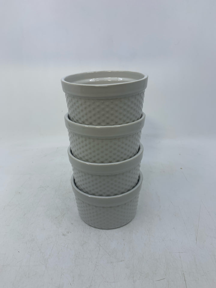 4 WHITE SINGLE BAKERS W/ EMBOSSED CIRCLES.