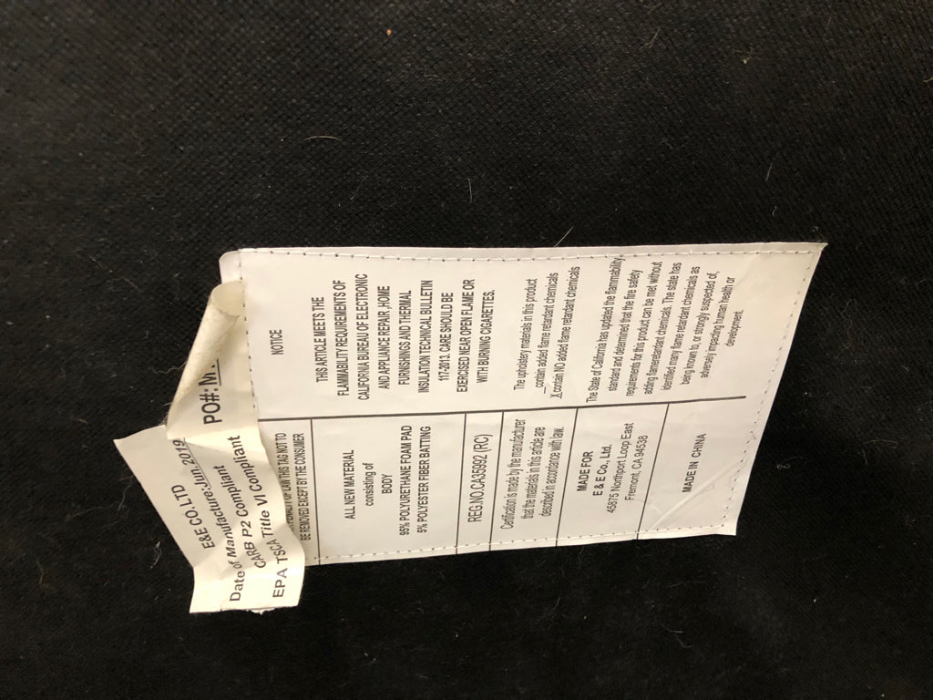 GREY FLORAL UPHOLSTERED OTTOMAN.