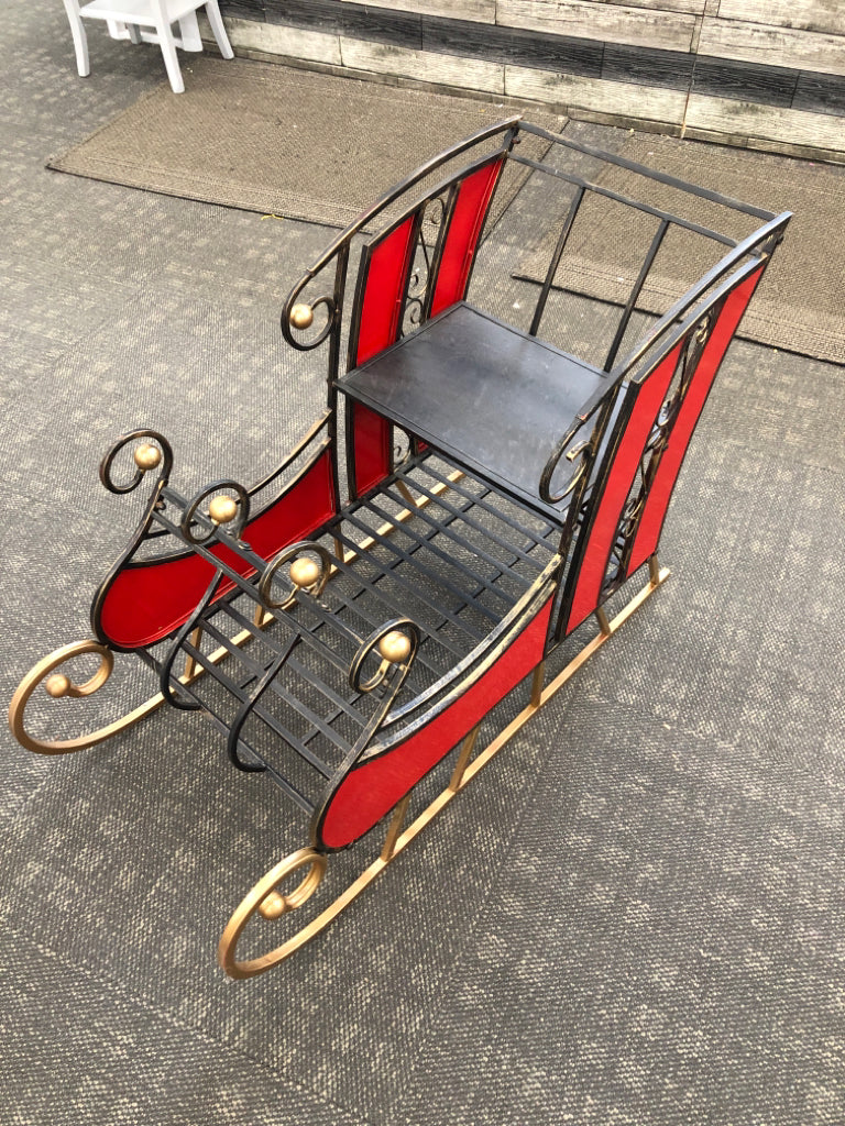 DISTRESSED METAL AND STAINED GLASS SLEIGH.