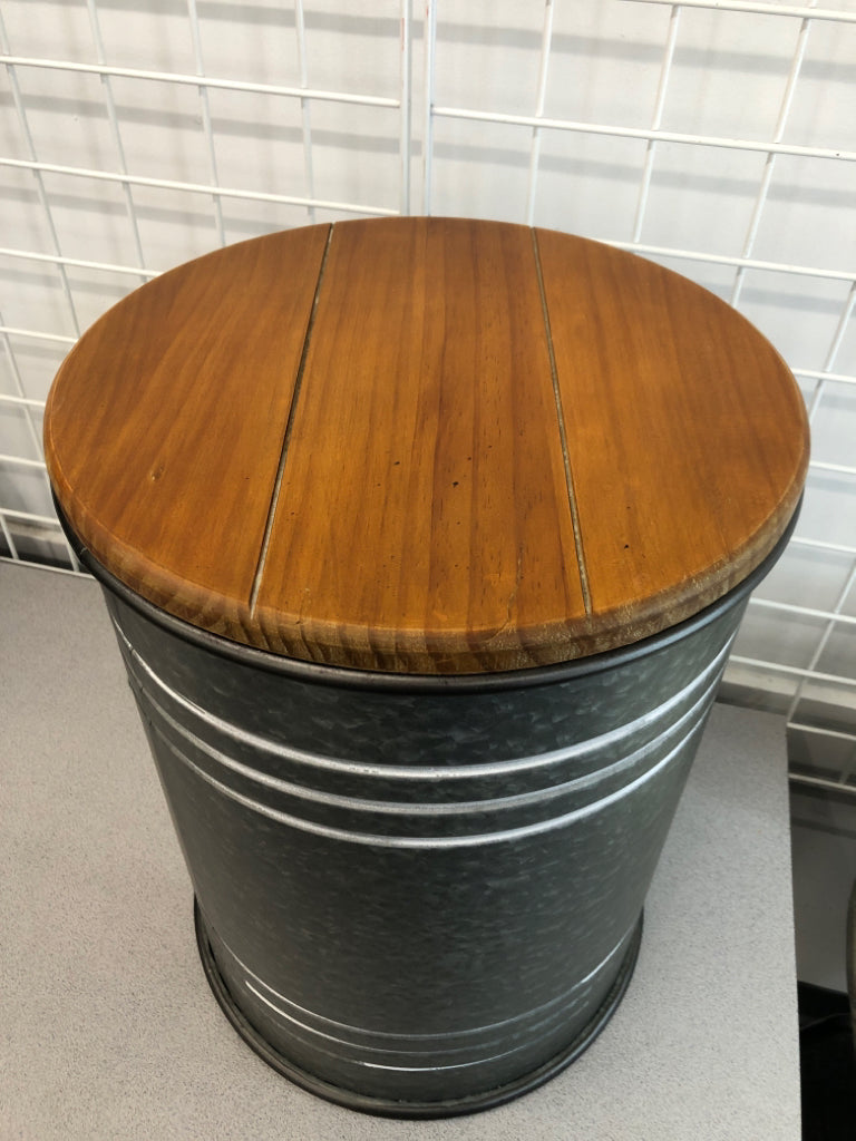 LARGE METAL BARREL HALLOW TABLE W/ WOOD TOP.