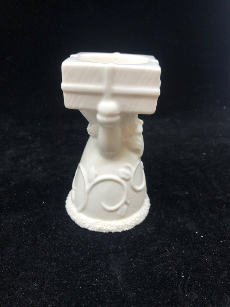 WHITE SANTA HOLDING PRESENT YANKEE CANDLE TEA LIGHT.