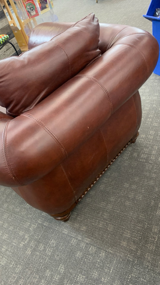 RED LEATHER CHAIR W/WOODEN UPHOLSTERY.