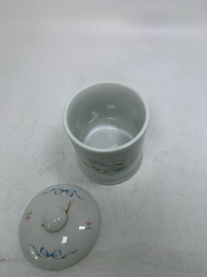 SMALL PORCELAIN CANISTER W/ PAINTED FLOWERS/BOWS.