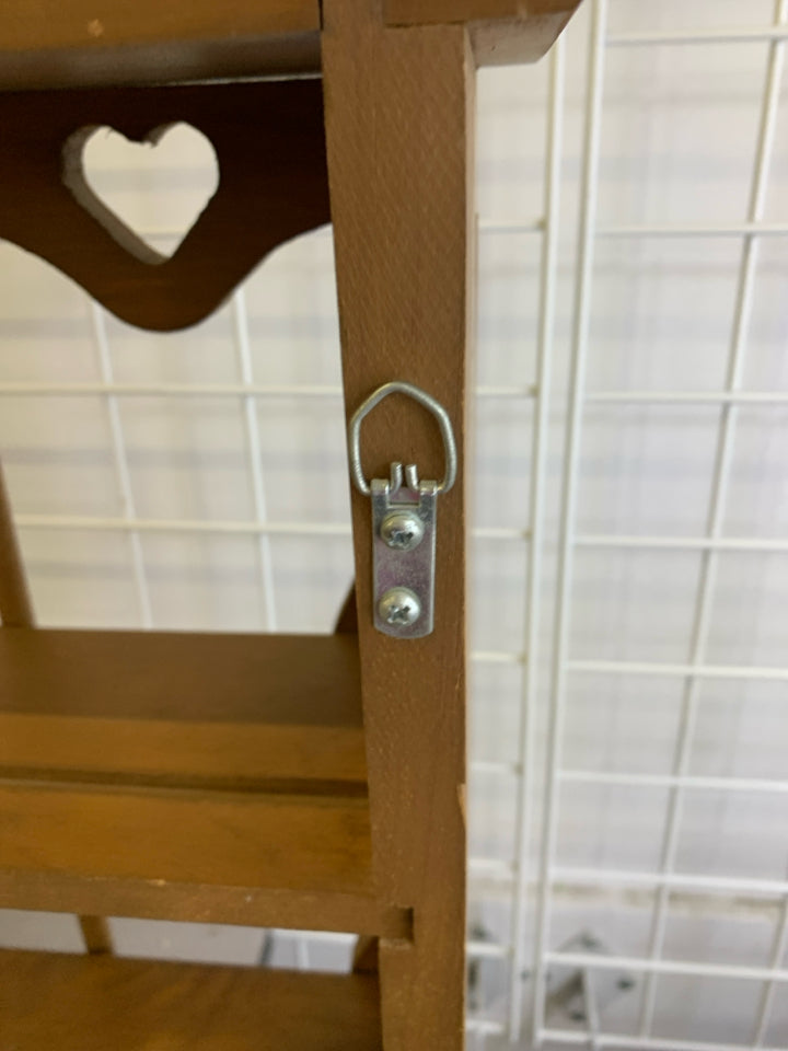 3 TIER WOOD SHELF W/ HEART CUTOUTS.