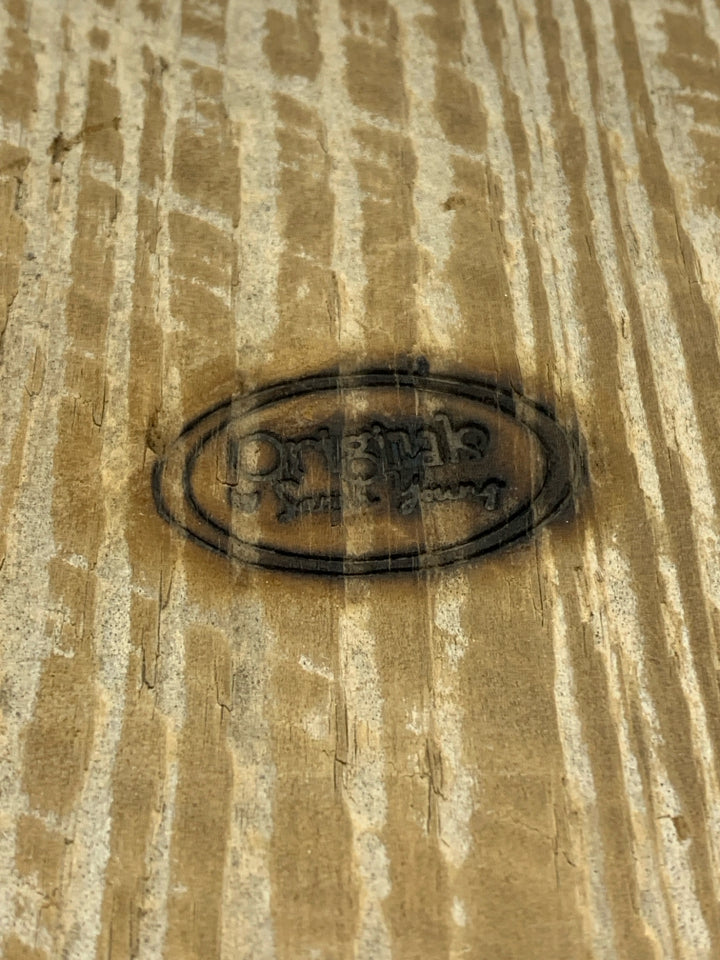 STRING ART SNAKE PLANT ON RUSTIC WOOD BLOCK.