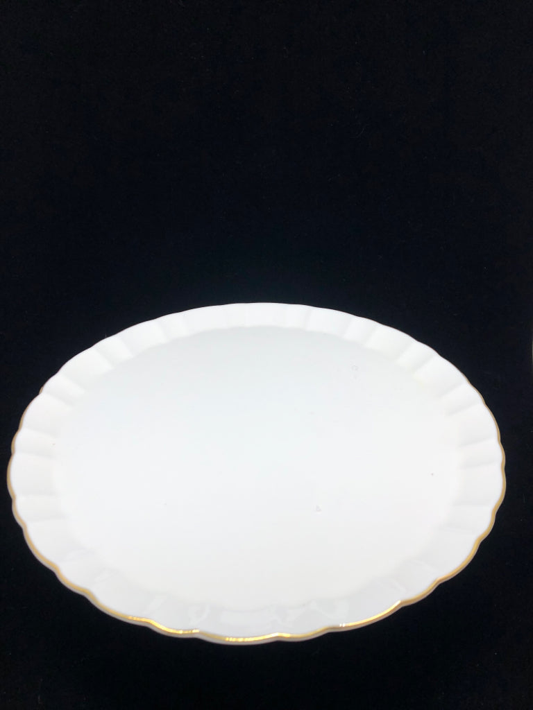 RAISED CAKE STAND W/GOLD TRIM.