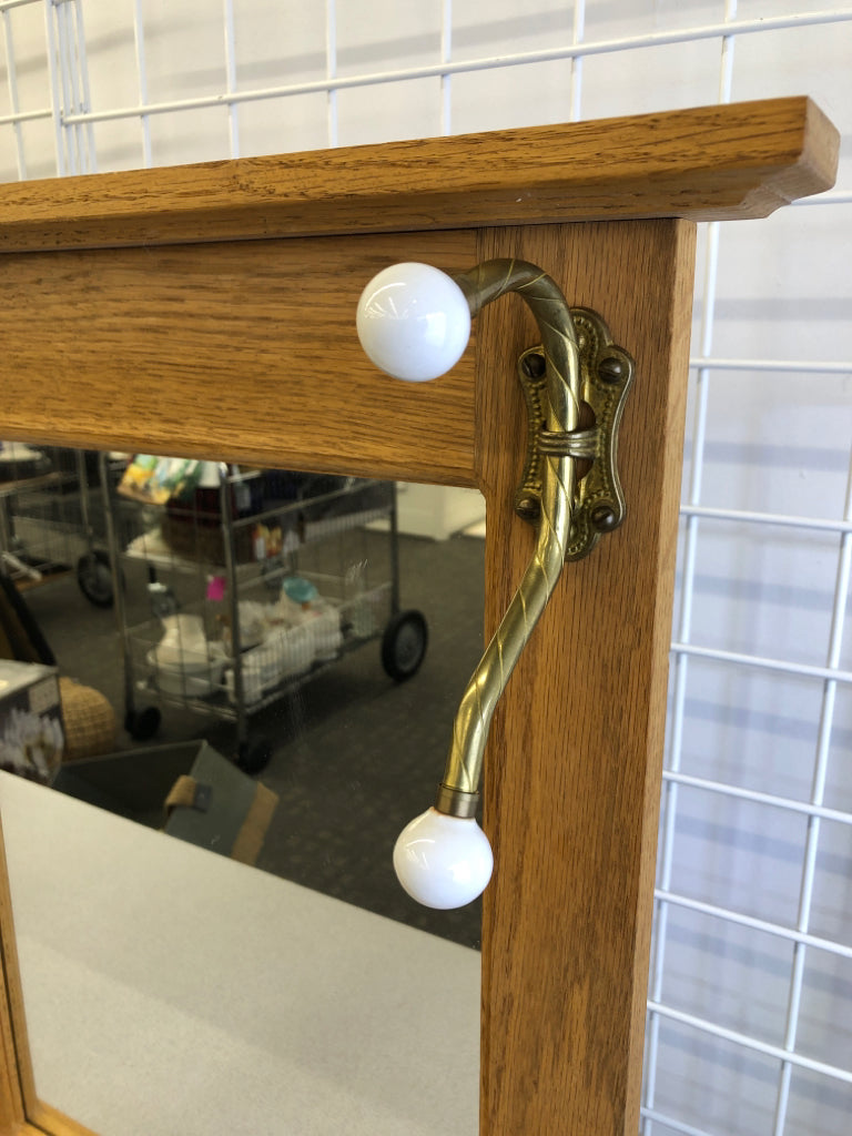 WALL MIRROR W/TWO COAT HOOKS.