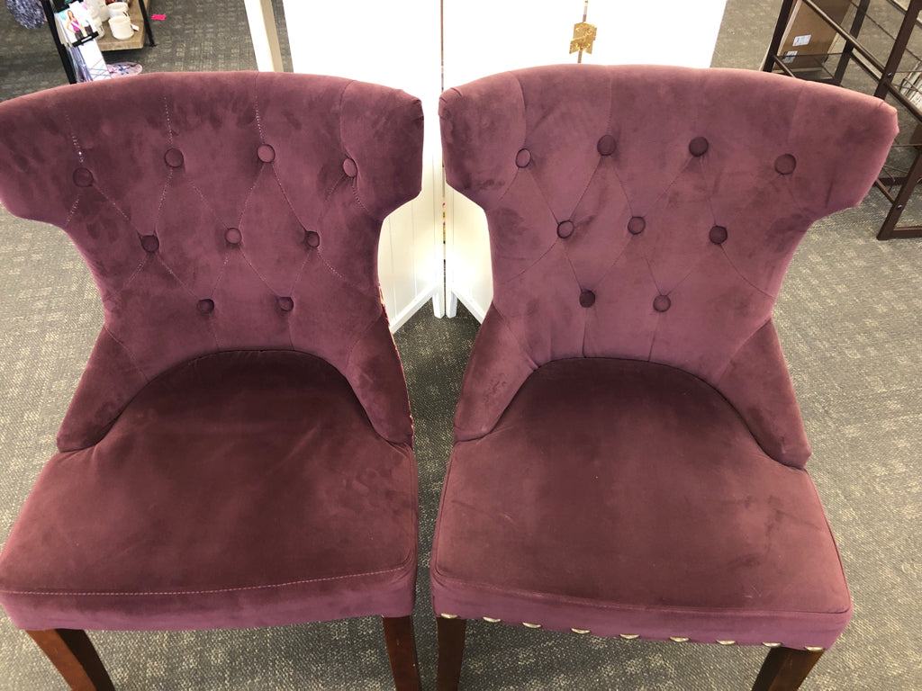 2 MAROON SUEDED CHAIRS W/PAISLEY DESIGN ON BACK & WOOD LEGS.