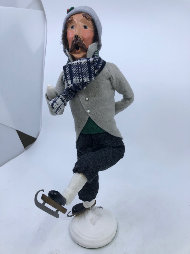 MAN IN GREY COAT W/BLUE & WHITE PLAID SCARF "THE SKATERS" 1991 BYERS' CHOICE.