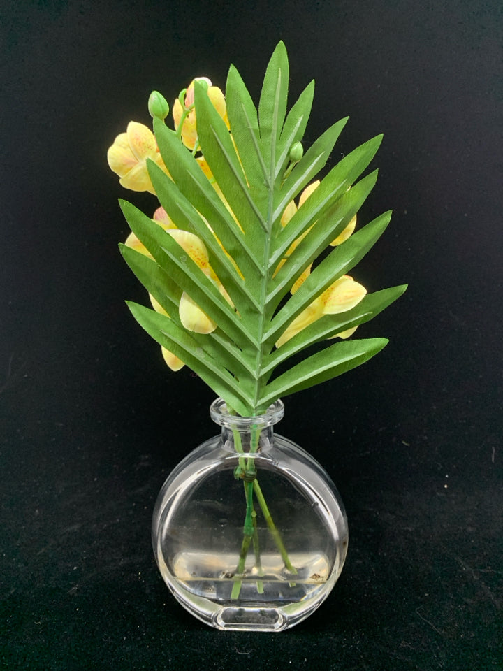 YELLOW FLORALS IN CLEAR FLAT VASE.