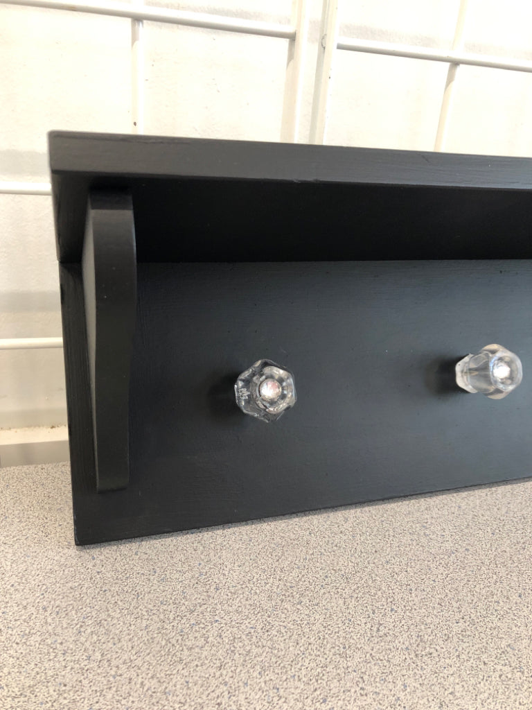 4 HOOK BLACK WALL SHELF W/CLEAR HOOKS.