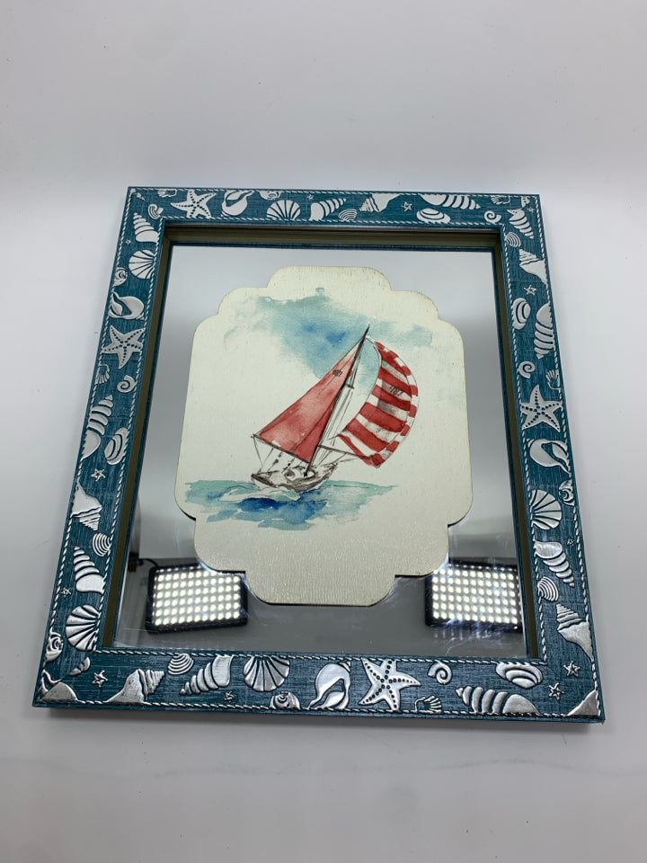 SAILBOAT MIRROR IN BLUE FRAME W/SILVER SEASHELLS.