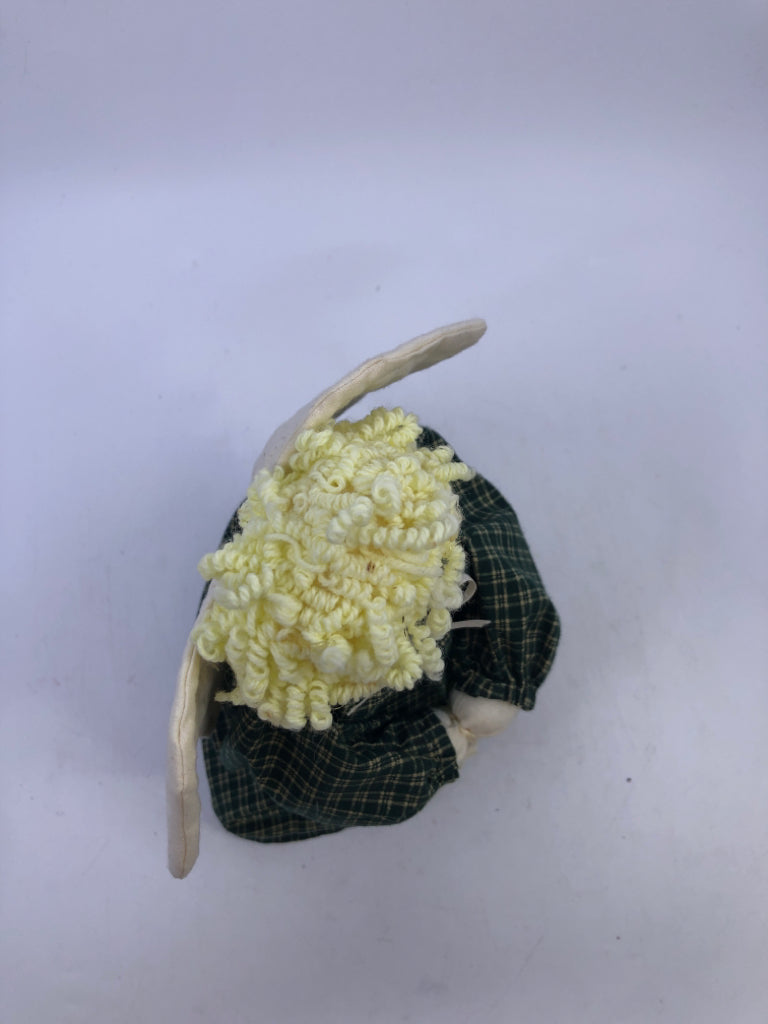 SOFT WHITE ANGEL IN GREEN FLANNEL DRESS.