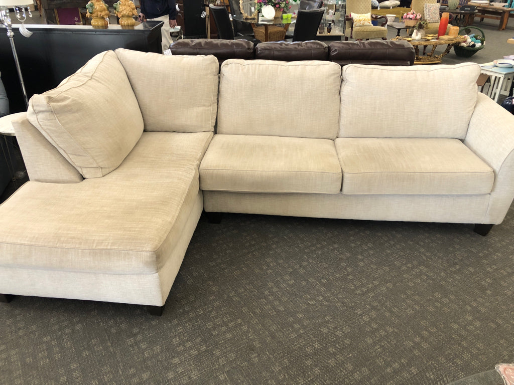 L-SHAPED CREAM COUCH.