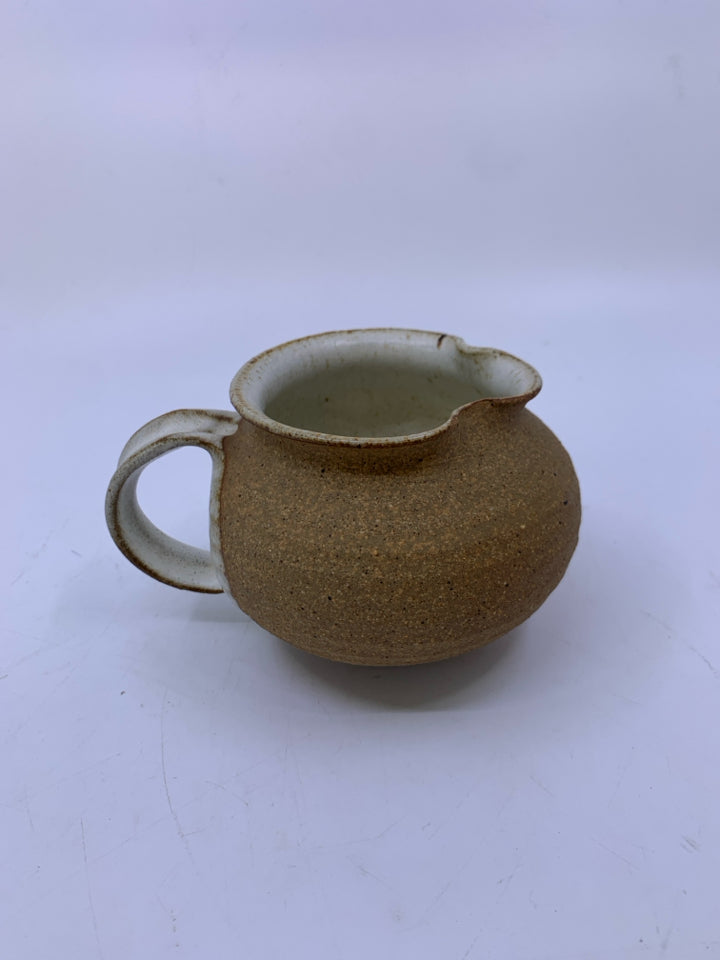 MATTE TAN CREAMER W/ WHITE SPECKLED SIDE/INSIDE POTTERY.