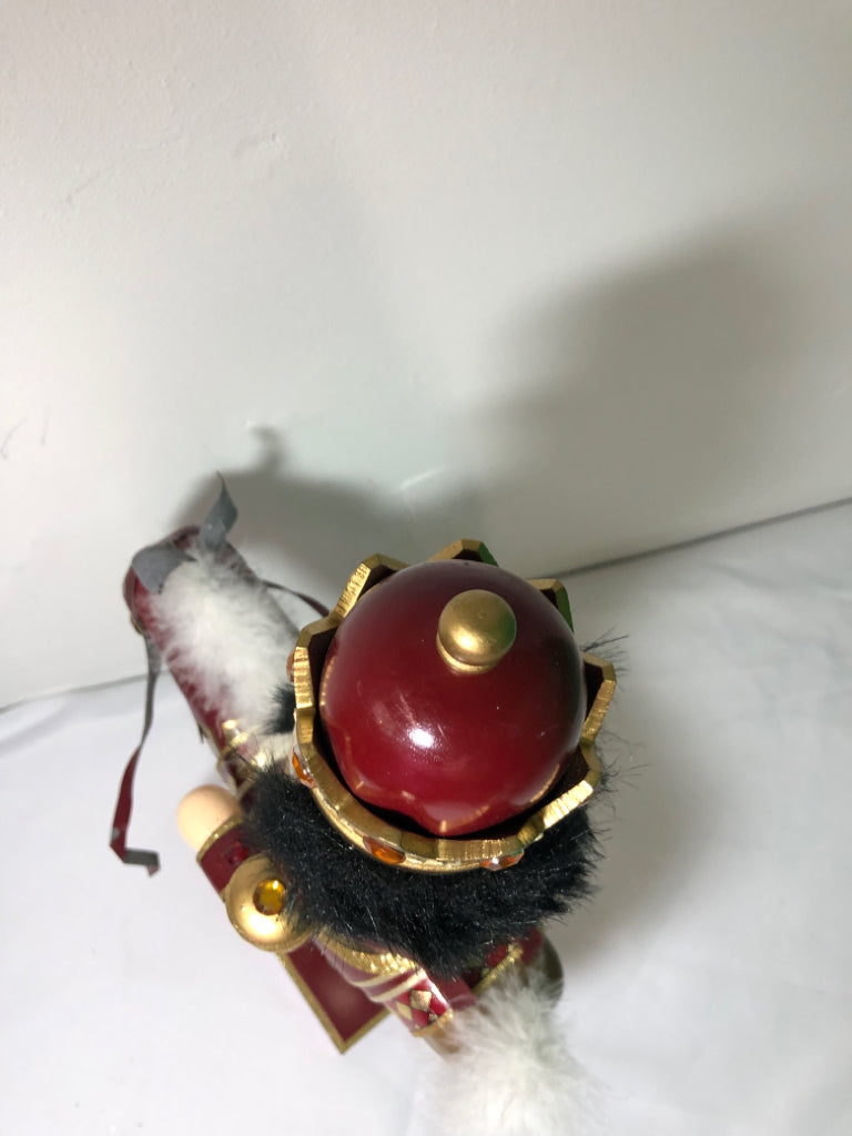 RED AND GOLD NUT CRACKER .