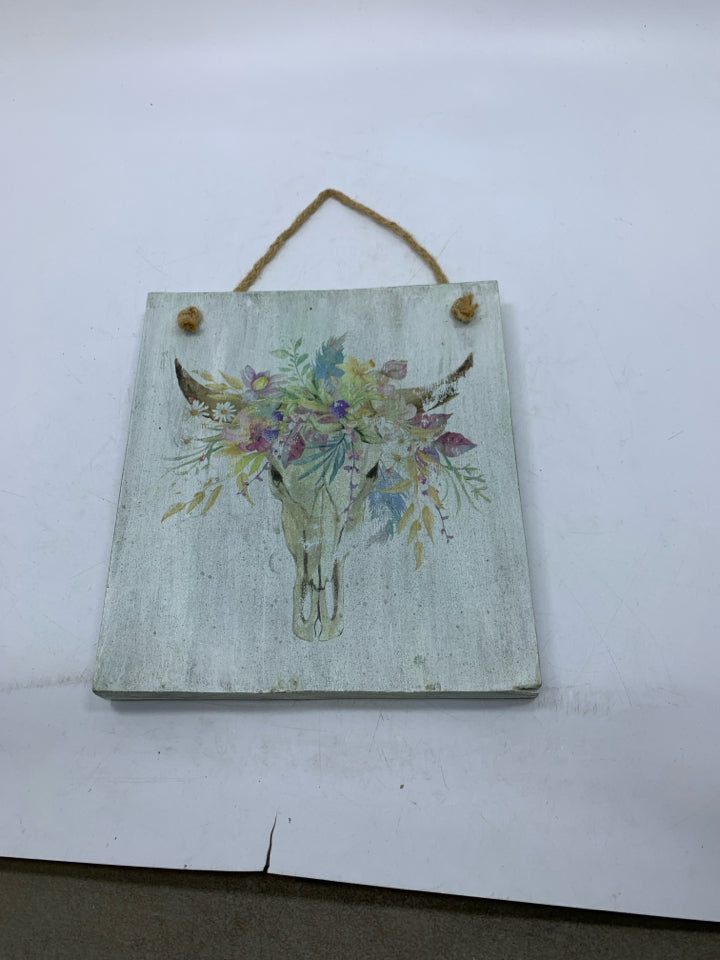 COW SKULL W/ FLORAL HEAD DRESS WALL SIGN.