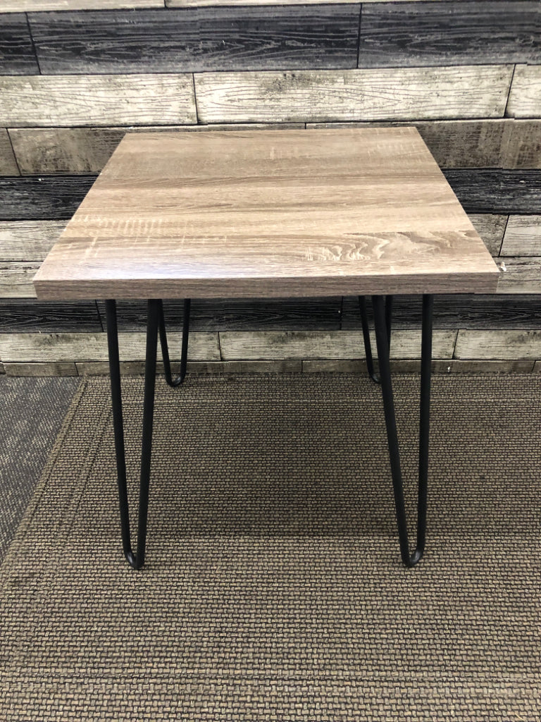 FAUX GREY WOOD SIDE TABLE W/ BLACK METAL PIN HAIR LEGS.