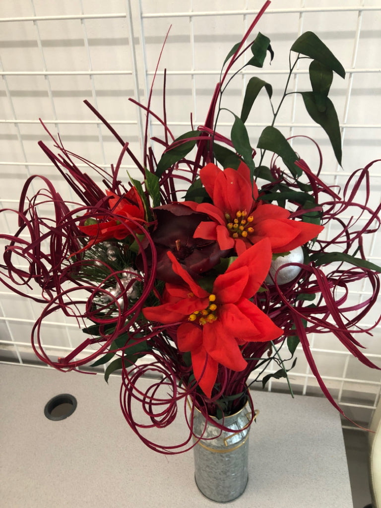 POINSETTIA /WINTER PIP IN GALVANIZED BUCKET.