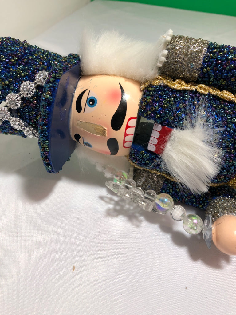 BLUE AND SILVER SNOWFLAKE NUT CRACKER.