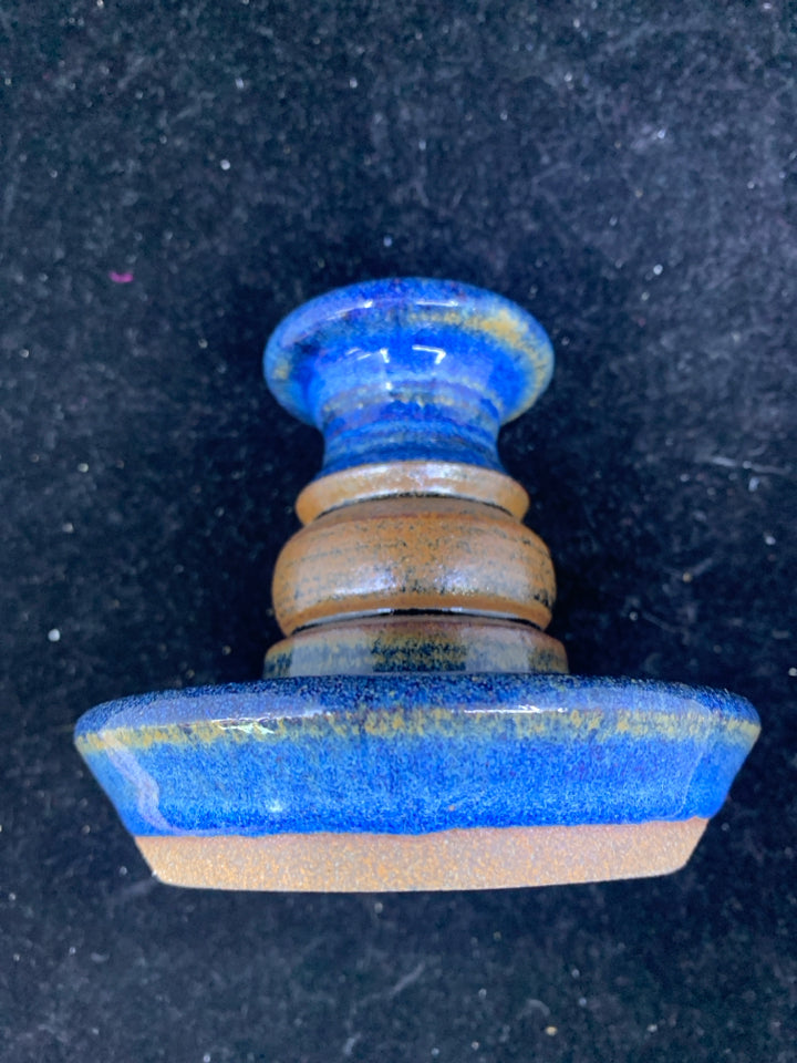 BLUE POTTERY TAPER CANDLE HOLDER.